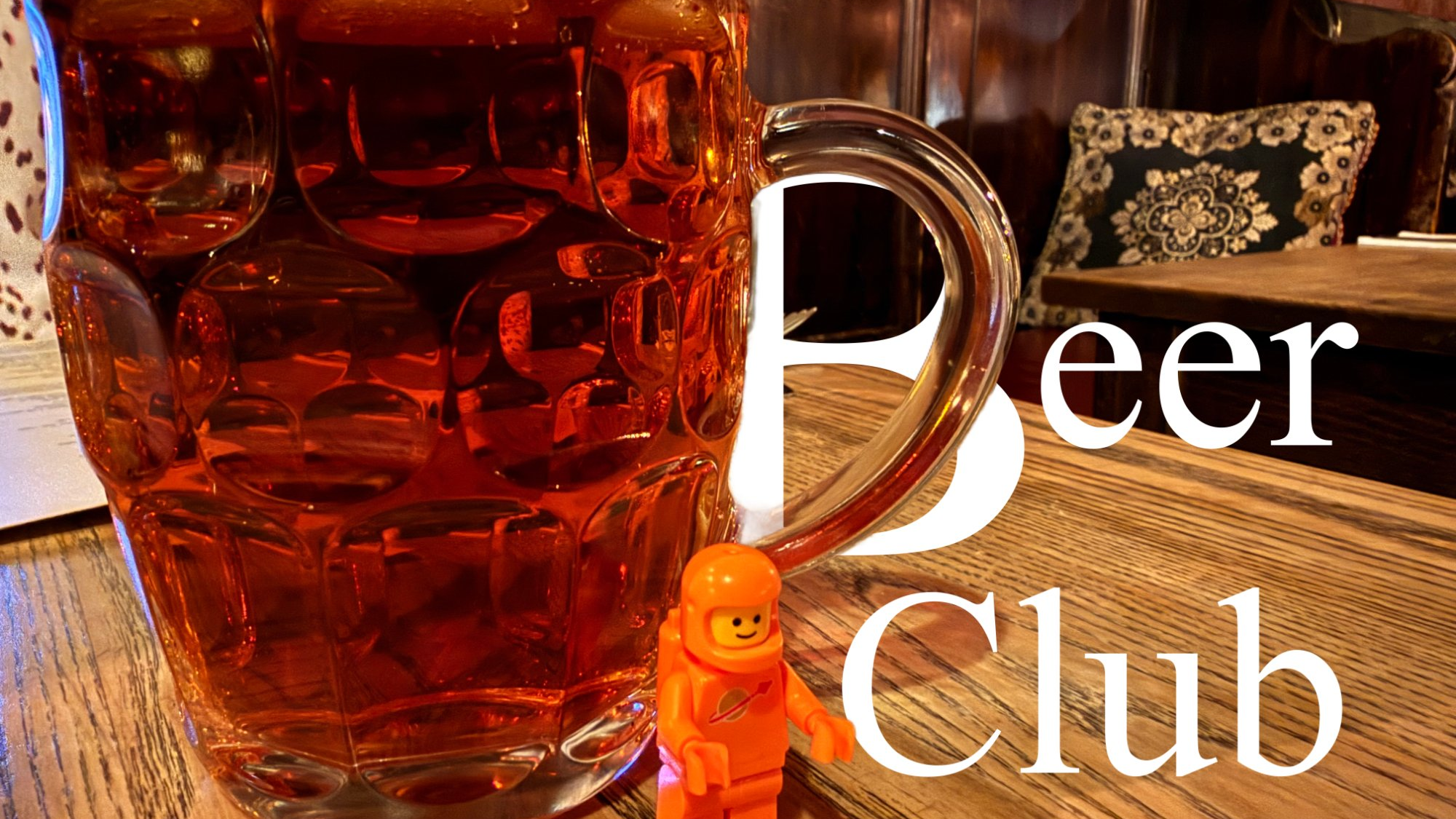Beer Club - a tiny astronaut contemplates a giant beer